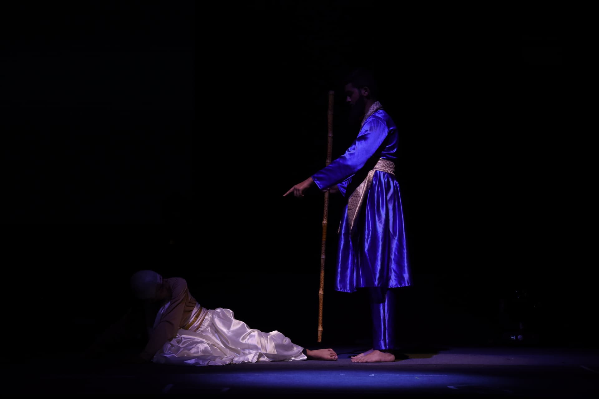 Dramatic spotlit theatre scene during a school stage show