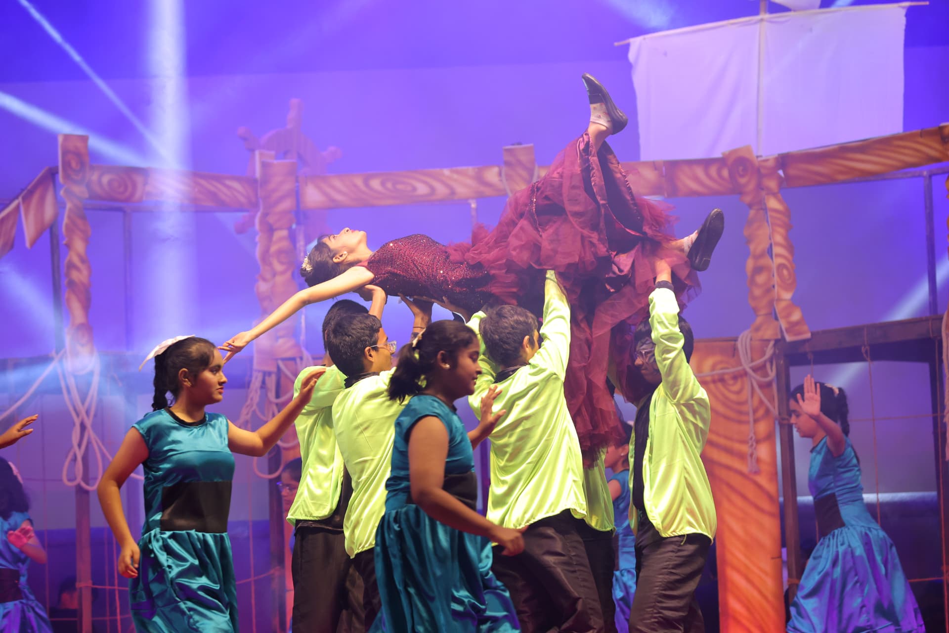 Ensemble dance lift performed by senior students during a school musical
